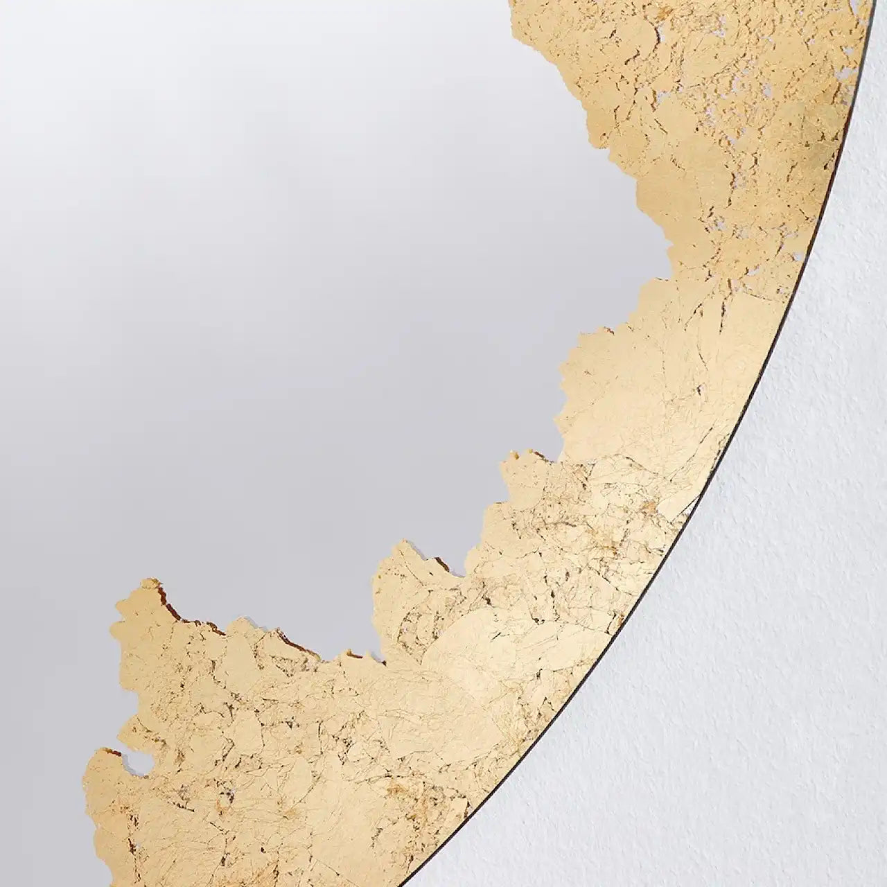 Miroir doré rond texture finition artisanale